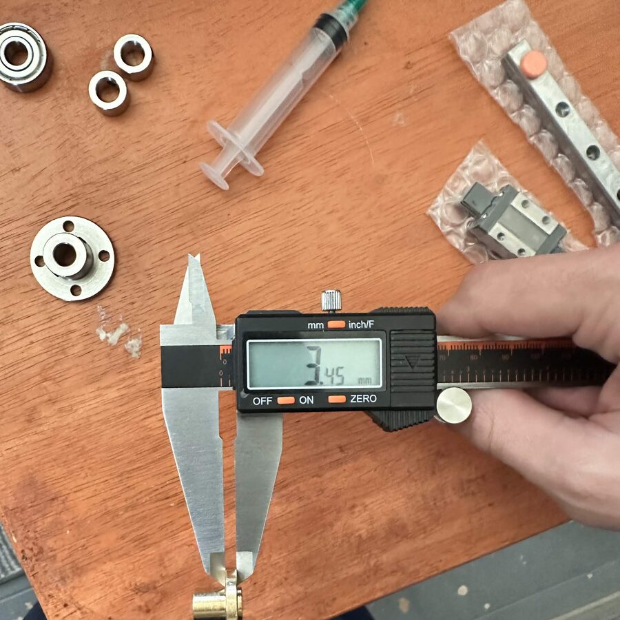 Extruder hardware laid out on a desk